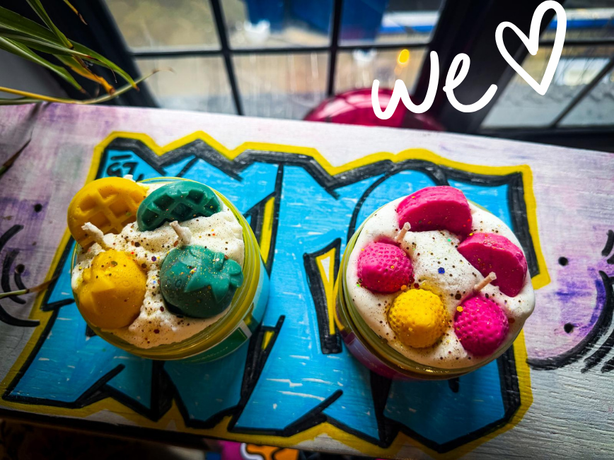 Photo of two candles by Kiki's House Candles & Melts Logo