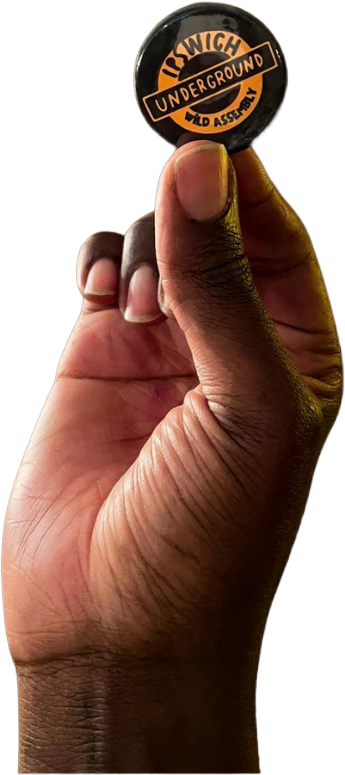 hand holding Ipswich Underground Button