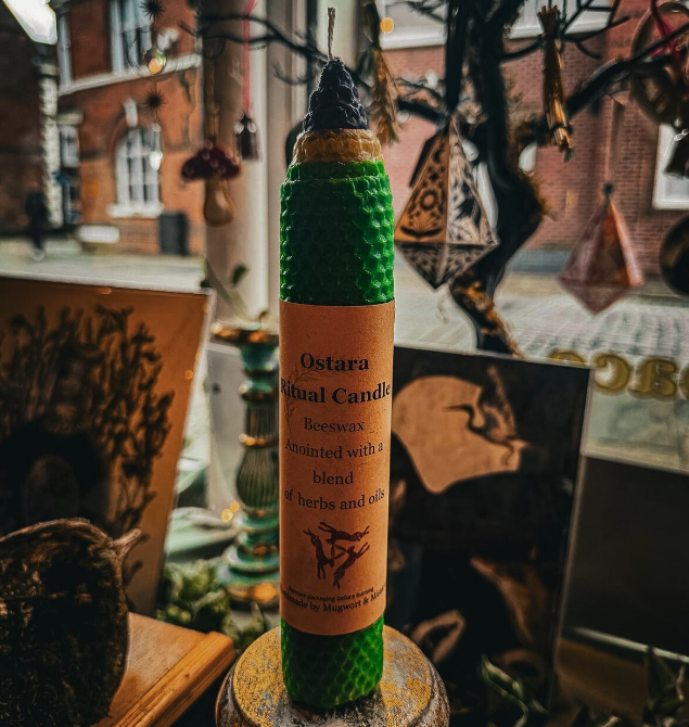 Photo of a green Ostara ritual candle made from beeswax